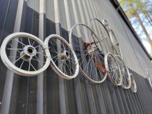 Bicycle wheels on the exterior wall of Eleven Winery.